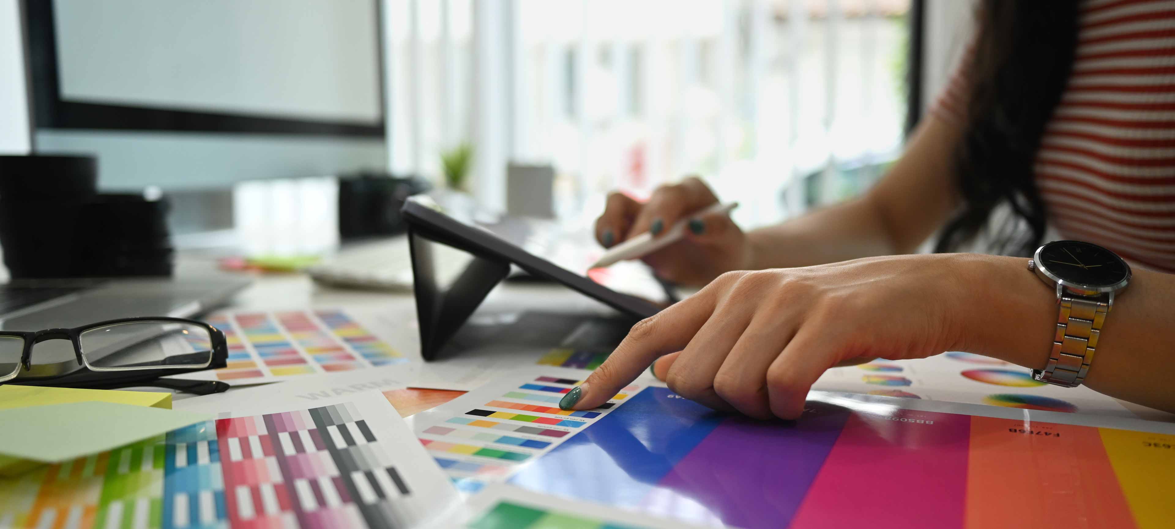 closeup view female designer working with color pallet