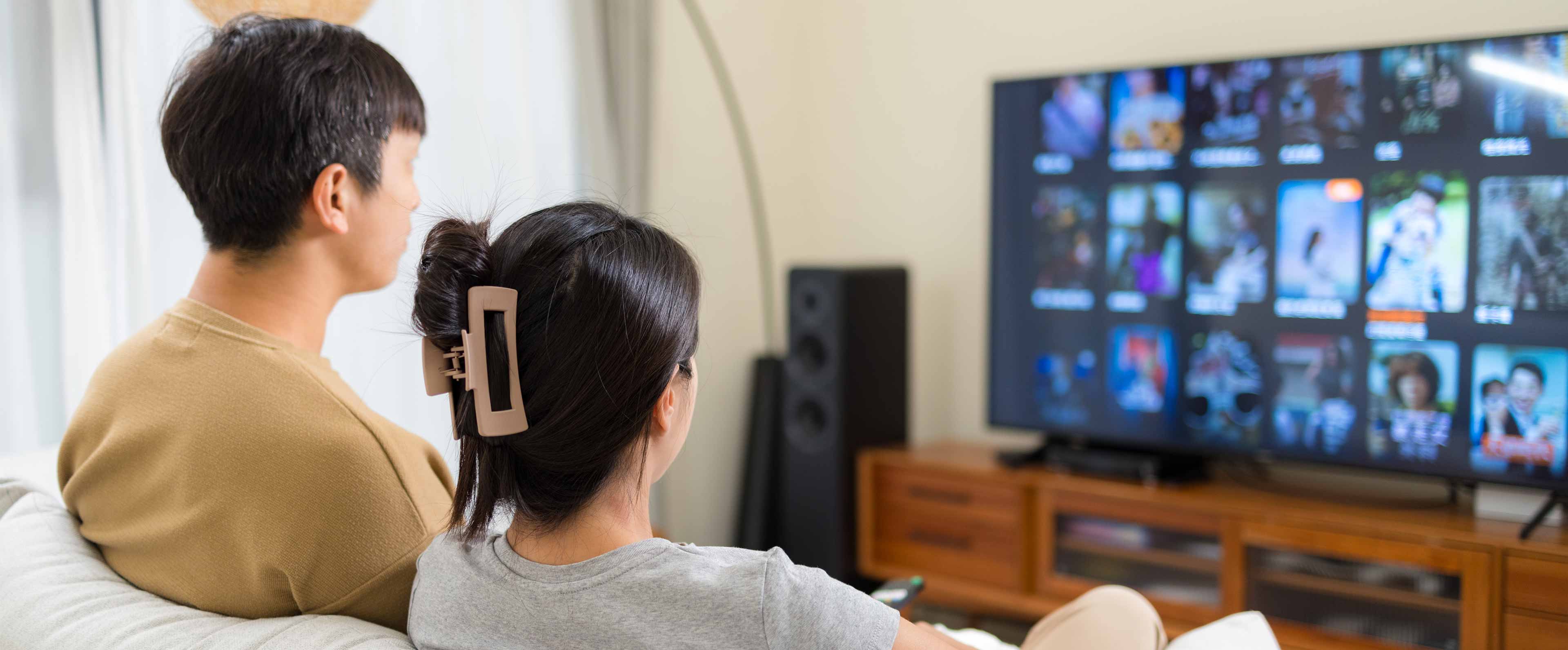 couple watch tv at home