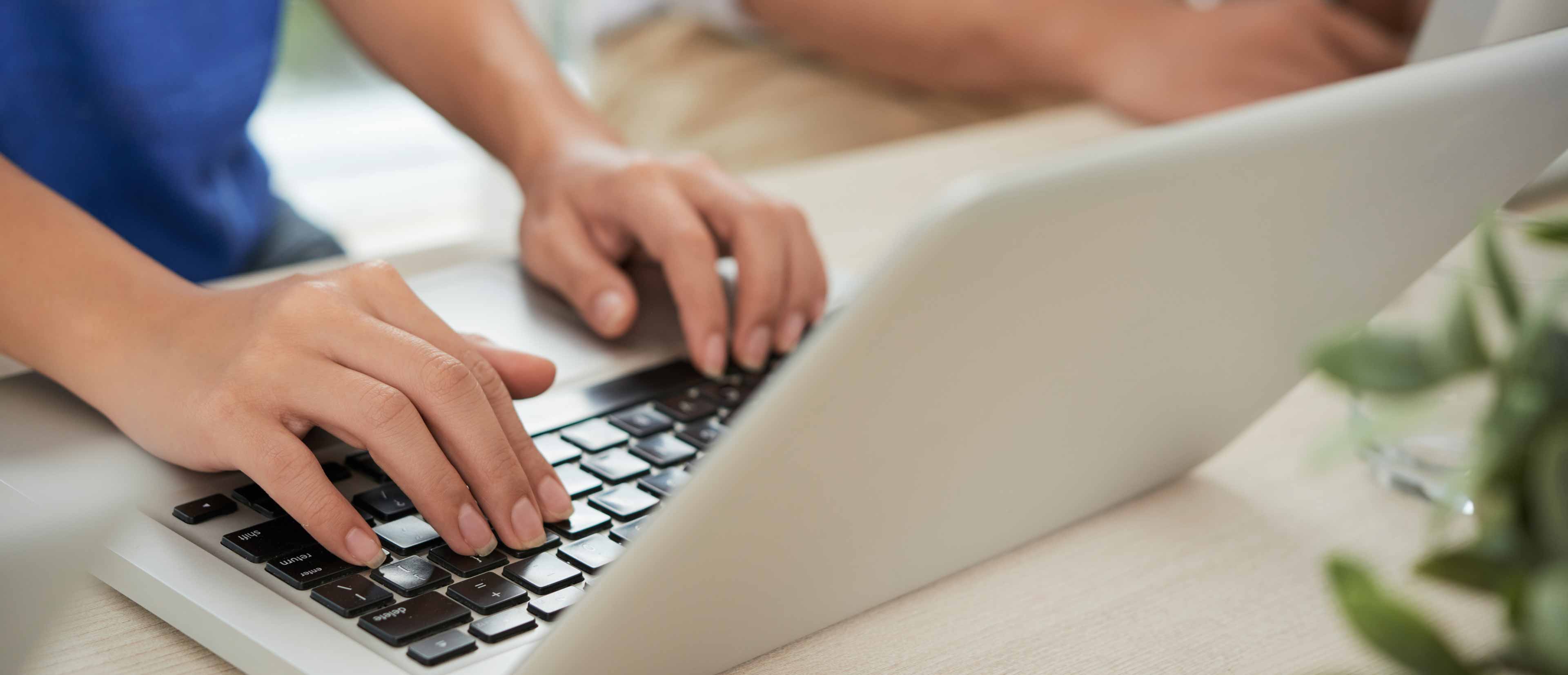 typing on laptop