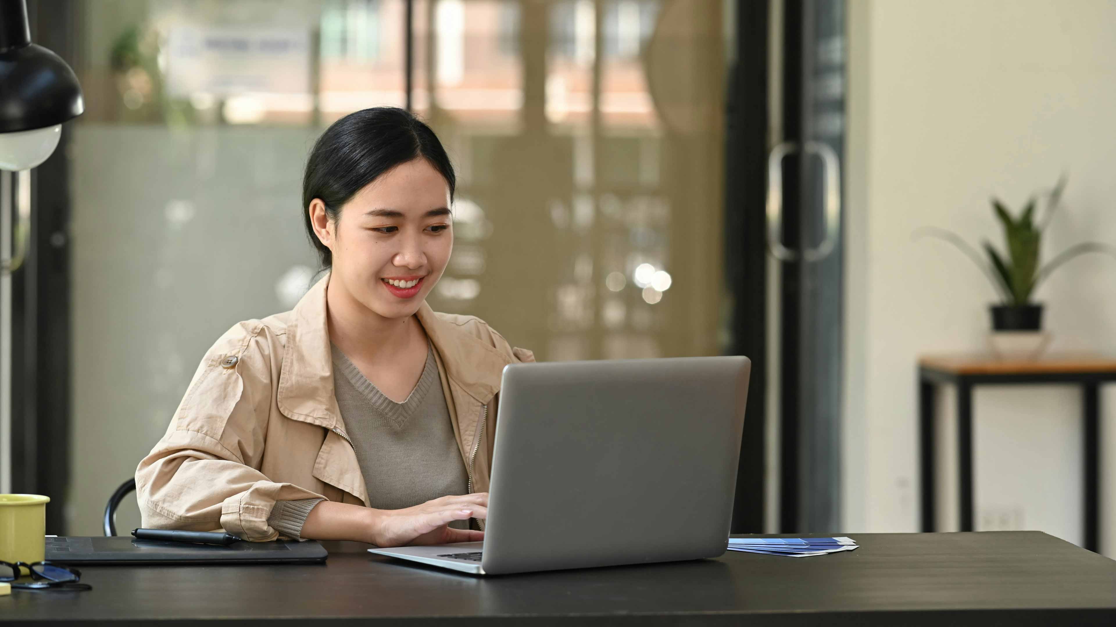 female web designer working on a design on her computer